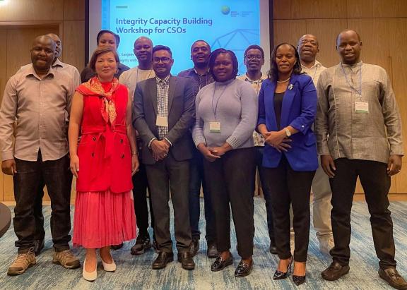 Participants of the workshop with Outreach and Engagement Manager Bayartsetseg Jigmiddash and Integrity and Compliance Manager, Sanjeev Narrainen